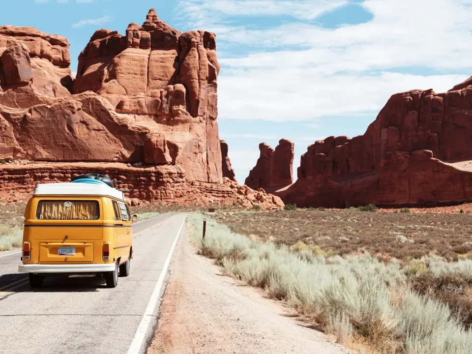 Road through red sandstone cliffs in Utah canyon country